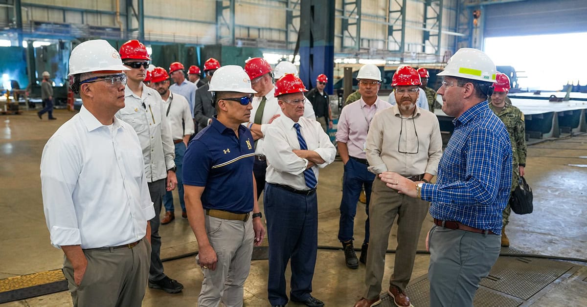 Photo: Hanwha Defense USA Navy and Hanwha executives. Acting Navy Secretary Hung Cao joined Hanwha Defense USA CEO Michael Coulter and other leaders on a tour of the Hanwha Philly Shipyard.